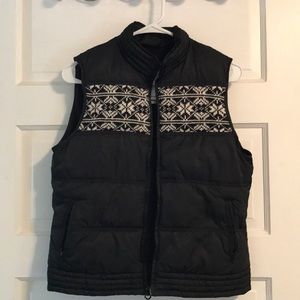 Black puffer vest with snowflake and heart detail